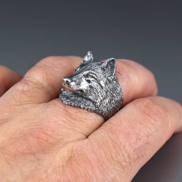 sterling silver wolf head ring on hand