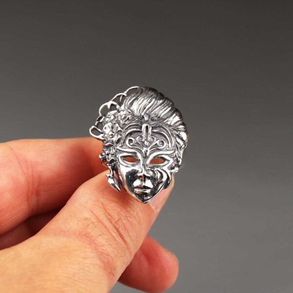 Handcrafted sterling silver mask ring with floral details, bold statement jewelry for women