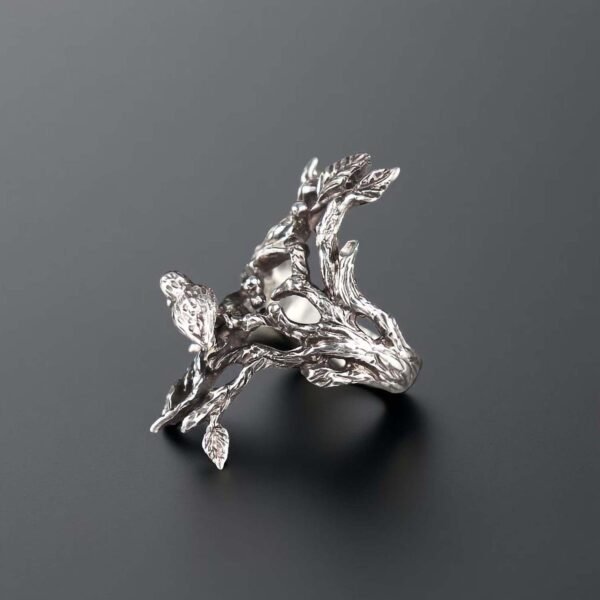 Sterling silver tree ring with a bird